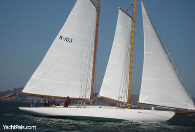 Yankee sailing past the San Francisco waterfront